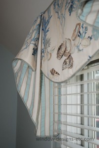 The cascade of the beach house valance is contrast lined in an ocean rippled stripe. Cape Cod Dining Room See more on www.windowdesignsetc.com by Marie Mouradian