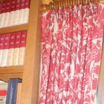 Red and white damask patterned pleated drapes on wooden rod. Designed and Created by Window Designs Etc. By Marie Mouradian