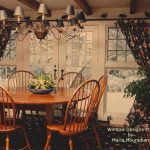 Black floral chintz tied tab panels in a dining room - See more at www.WindowDesignsEtc.com by Marie Mouradian