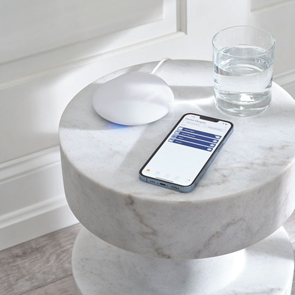 Phone control and Gateway for automatic shades on a white marble table